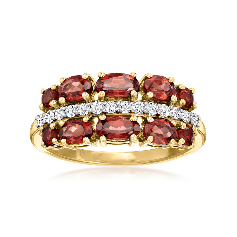 14kt yellow gold ring with oval garnet center, round garnets, and diamond accents