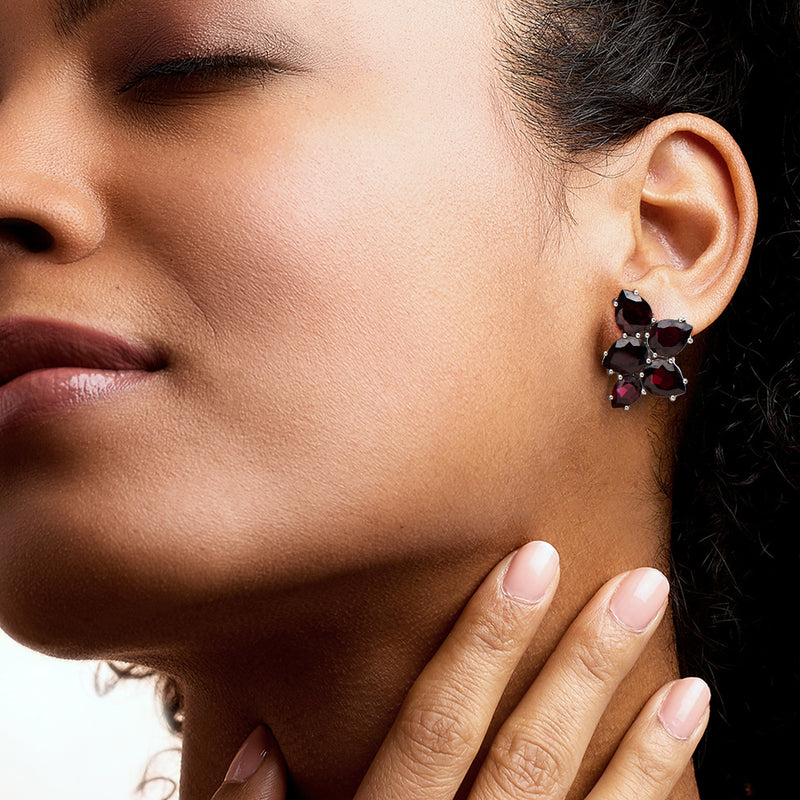 Garnet cluster earrings on model: dark red gems in sterling silver with sparkle accents