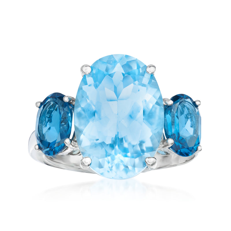 Sterling silver ring with large light blue topaz center and two teardrop side stones