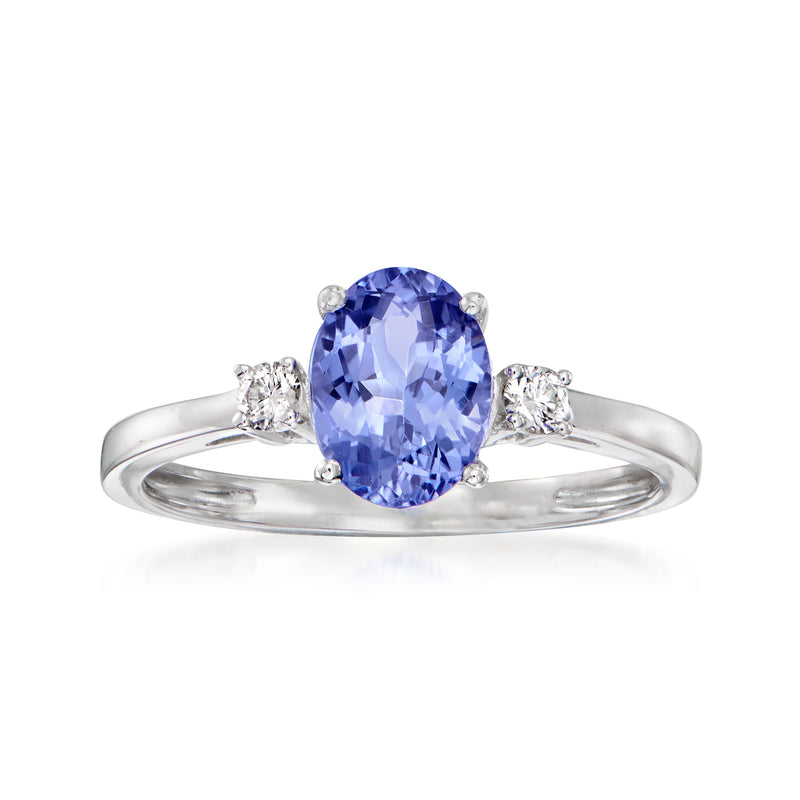 Oval blue tanzanite ring in 14kt white gold with diamond side stones
