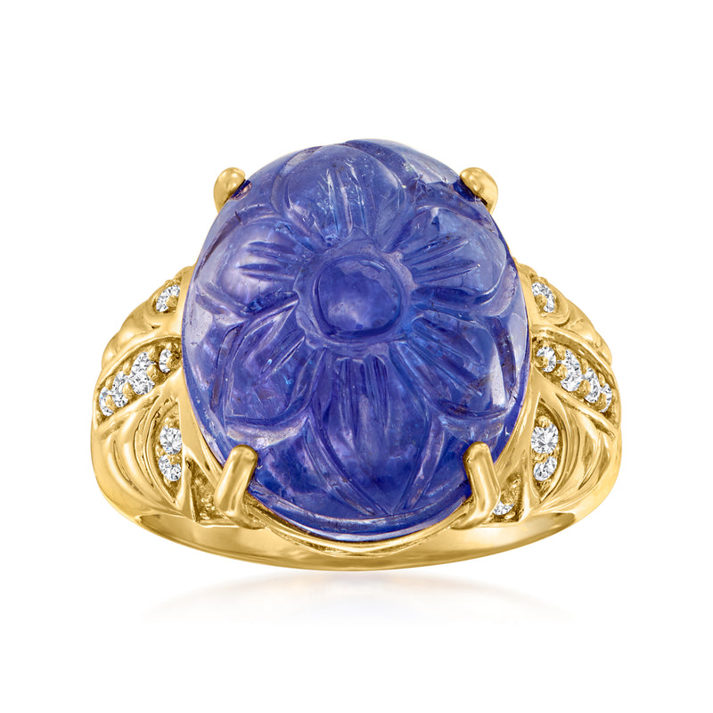 18kt yellow gold ring with large carved blue tanzanite oval center and diamond accents