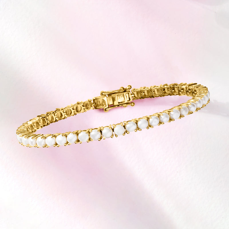 Cultured pearl tennis bracelet with white 4mm pearls, gold clasp, and link setting