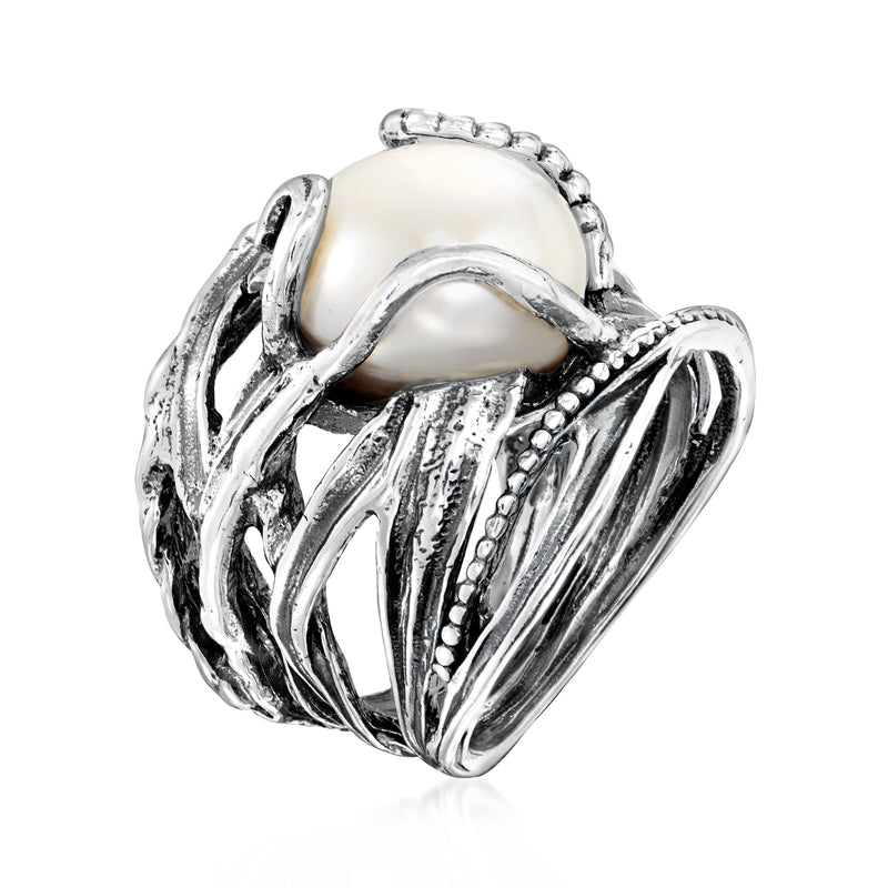 Sterling silver cultured pearl ring, side view with raised textured bands and openwork setting
