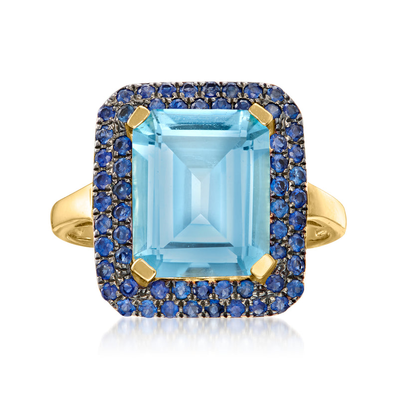 14kt yellow gold ring with large sky-blue topaz center and sapphire halo, cushion setting