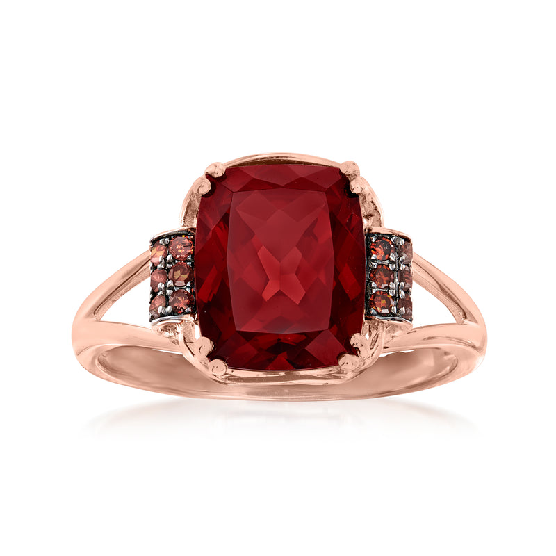 14kt rose gold garnet ring with cushion-cut garnet center and red diamond side stones