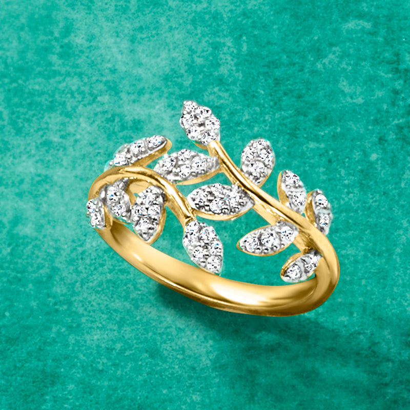Gold vine diamond ring with marquise and oval stones on openwork band.