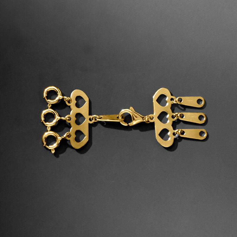 14kt yellow gold layering clasp with heart cutout plates and hinge-style toggle rings