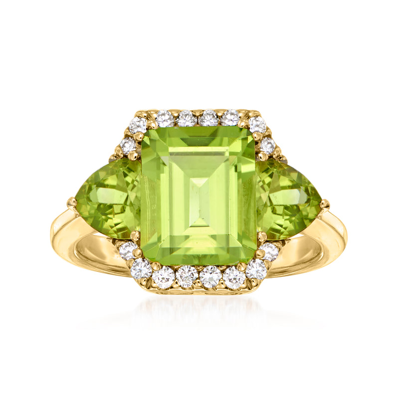 14kt yellow gold ring with cushion green peridot and round diamond accents, halo style