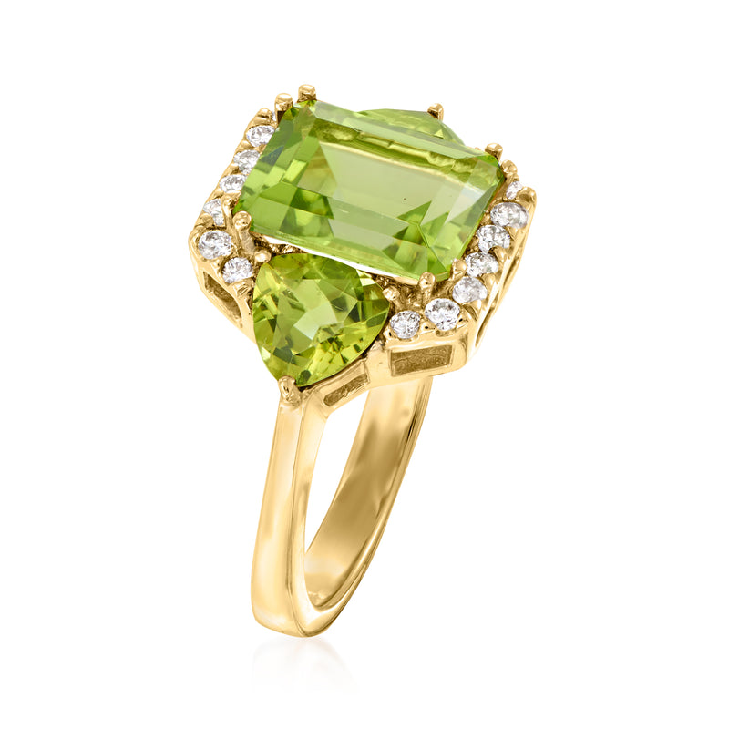 14kt yellow gold ring with large cushion green peridot and round diamonds, angled view