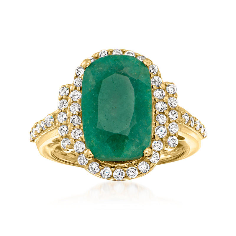 Emerald-cut green gemstone halo ring with round diamond accents, gold band