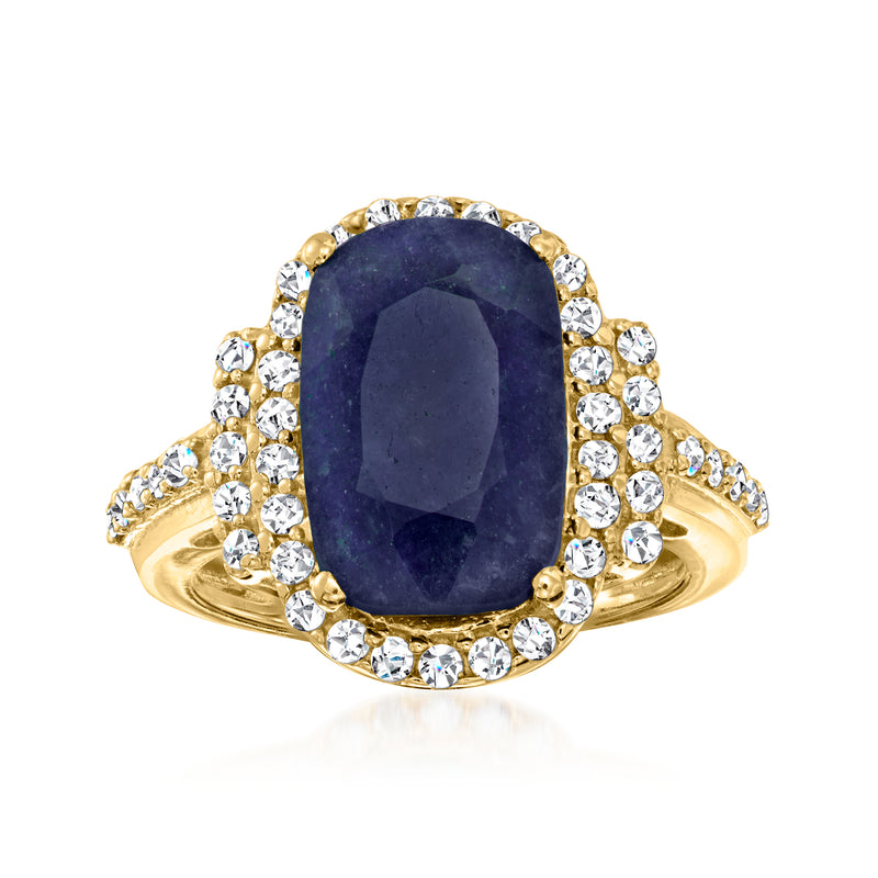 Oval dark blue sapphire ring with round diamond halo and gold band