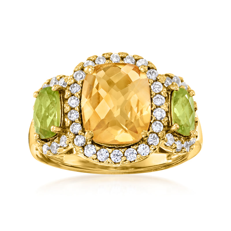 Gold-tone oval citrine ring with white stones halo and green side peridots