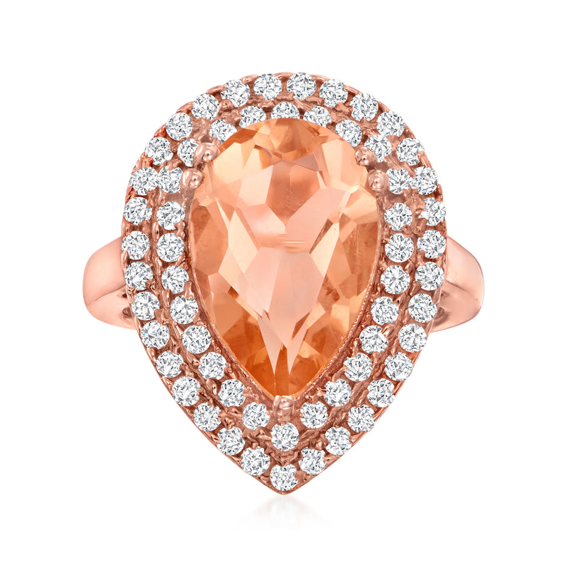 Rose gold-tone ring with peach oval center stone and round CZ halo