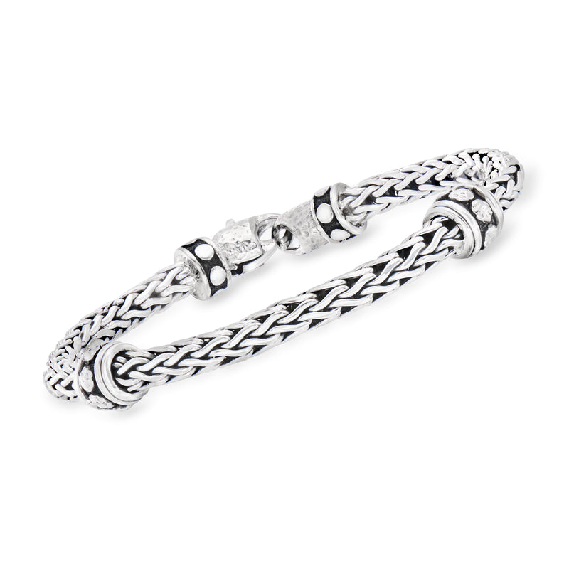 Sterling silver woven station bracelet with round studded accents and clasp