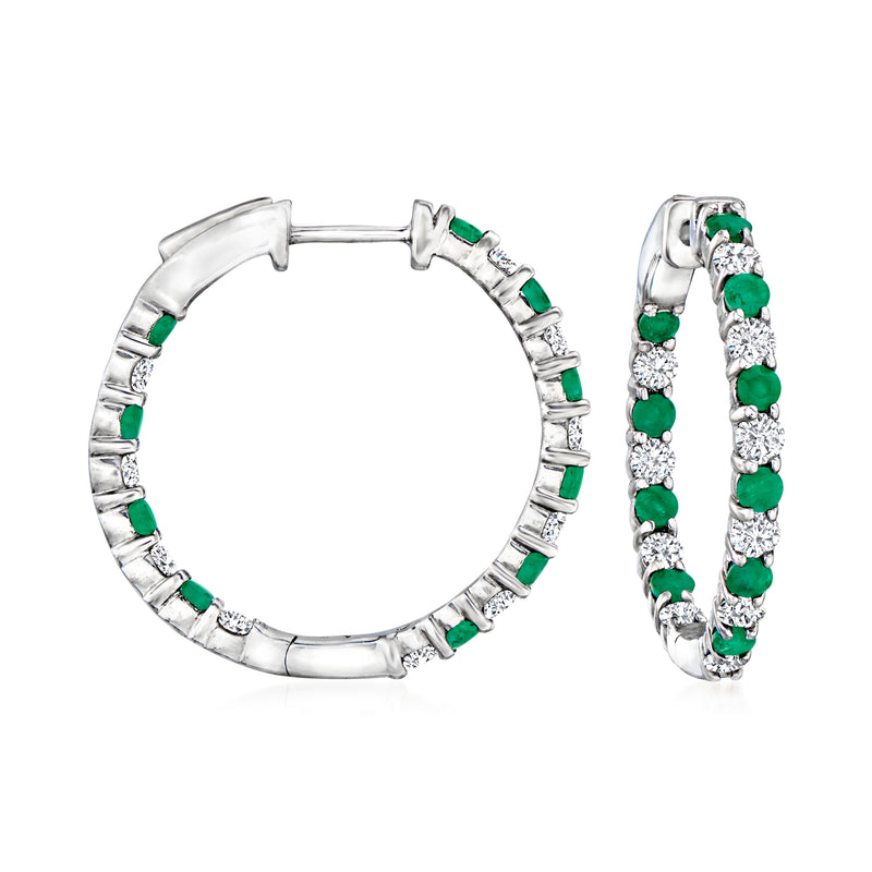 Sterling silver hoop earrings with green emeralds and diamond accents, hinged clasp.