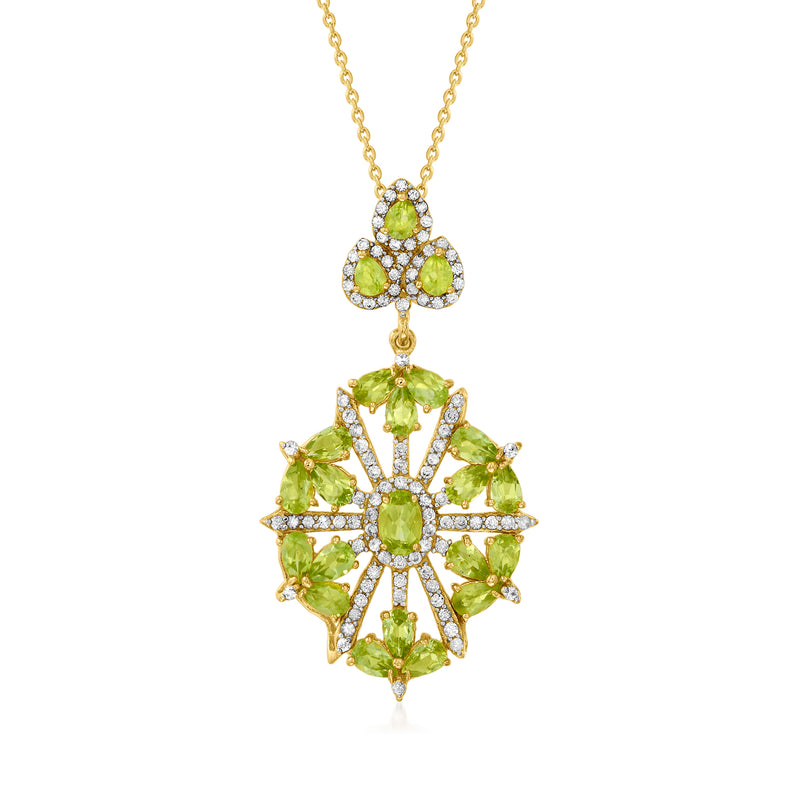 Gold pendant necklace with green peridot and white topaz in a flower halo design