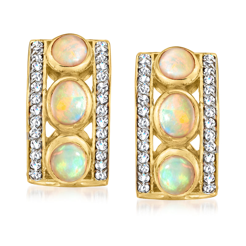 Gold-tone opal stud earrings with three opal cabochons and crystal side stones