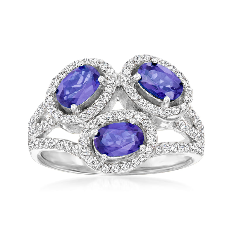 Sterling silver ring with three oval blue tanzanite stones and white zircon halos