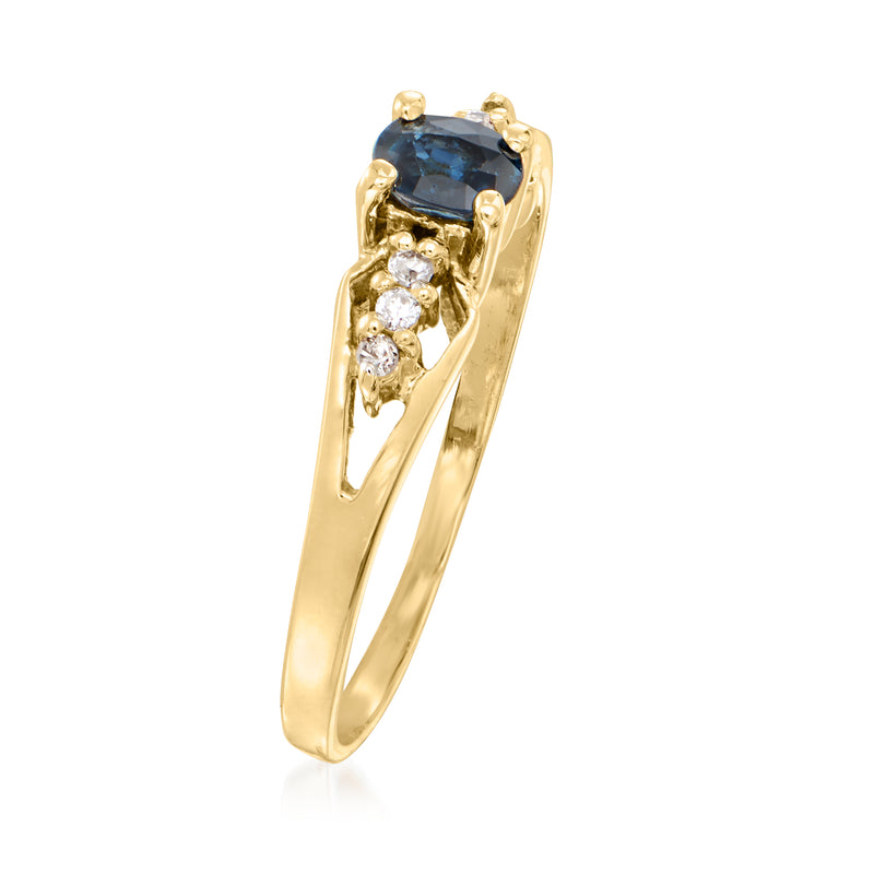 14kt yellow gold ring with tall setting, blue sapphire center, and diamond side stones