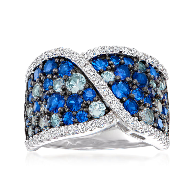 Sterling silver ring with blue simulated sapphire and CZ stone clusters