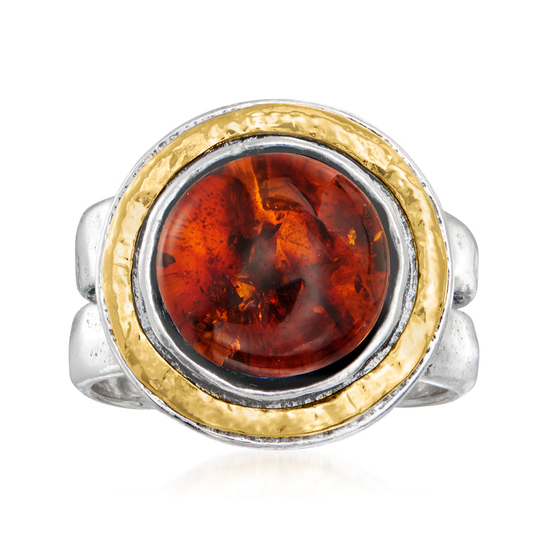Two-tone sterling silver ring with gold bezel and oval amber gemstone center
