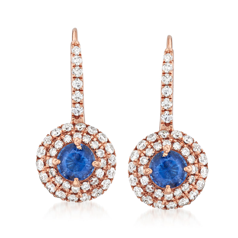 Rose gold drop earrings with round blue sapphire surrounded by diamond halo