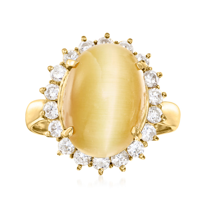Vintage oval cat's-eye tourmaline ring with diamond halo and yellow gold band