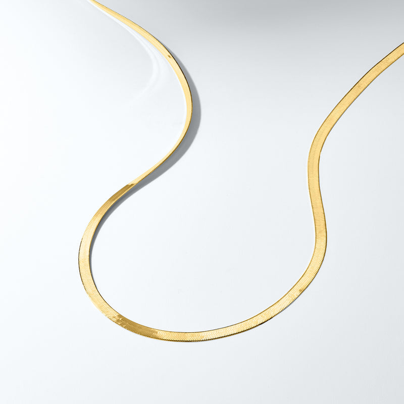 14kt yellow gold herringbone necklace chain with textured drape