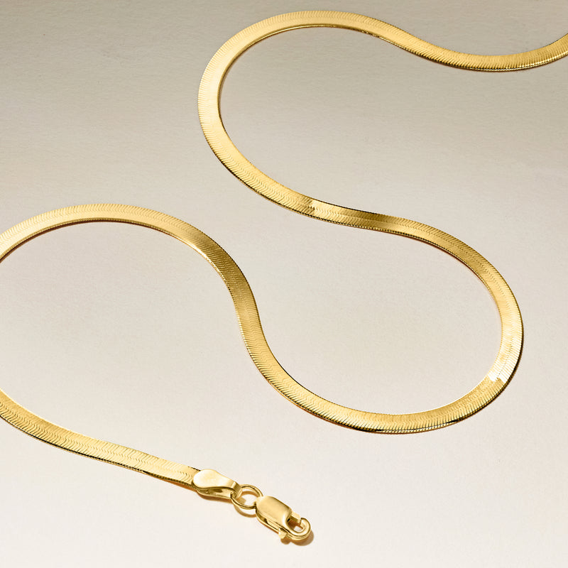 14kt yellow gold herringbone necklace with clasp, laid out