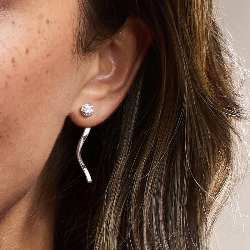 Sterling silver twisted drop earring jacket on ear, round crystal stud with twisted drop