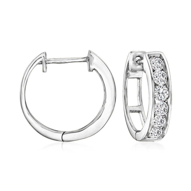 14kt white gold diamond huggie hoop earrings with bezel-set round diamonds, hinged.