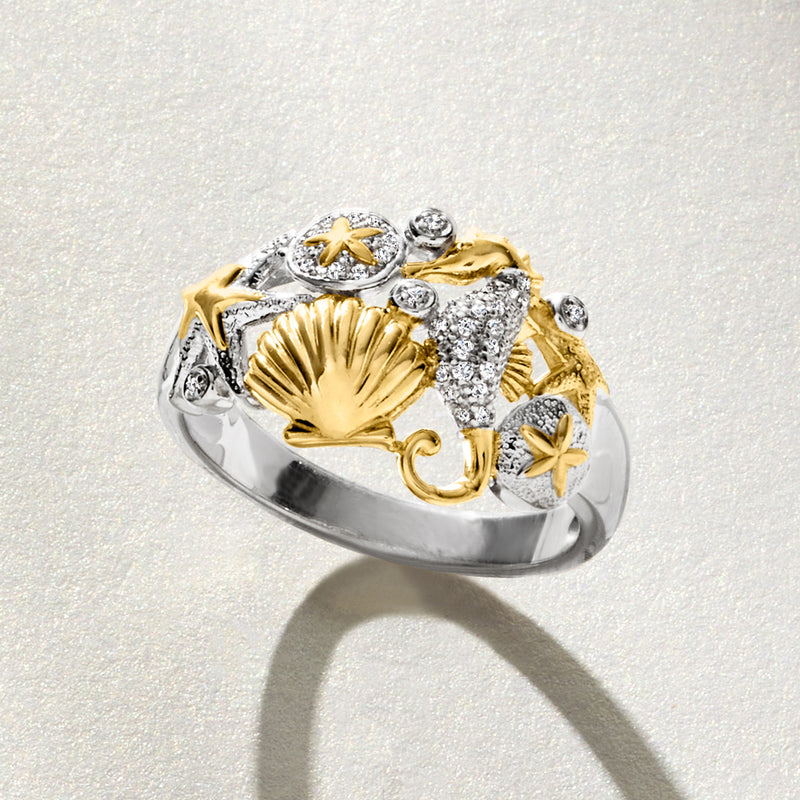 Two-tone sterling silver ring with gold scallop shell, starfish, and round diamond accents