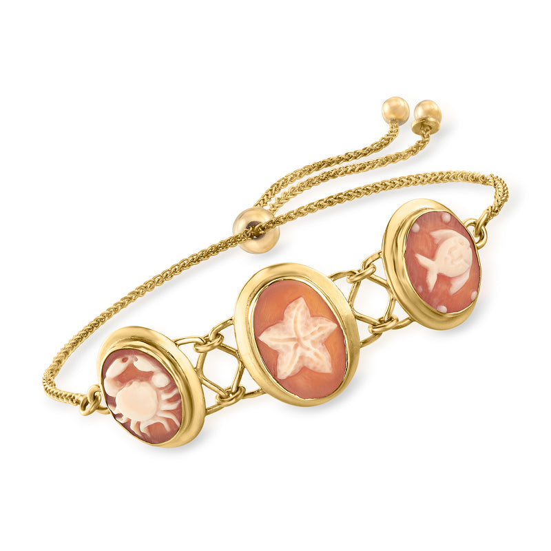 Gold bolo bracelet with three oval orange shell cameo links