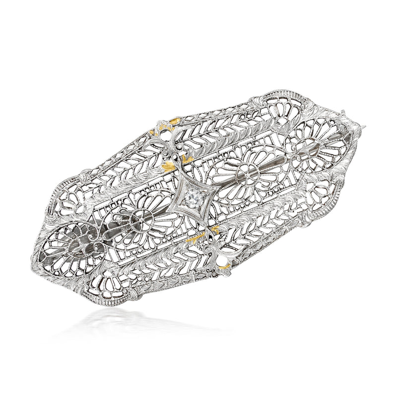 Vintage diamond-accented filigree pin in 14kt white gold, ornate oval design