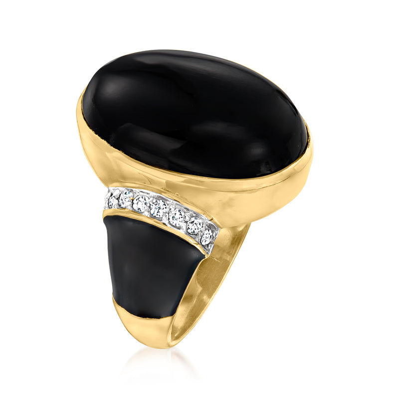 Gold-tone ring with black oval top, diamond band detail on the sides