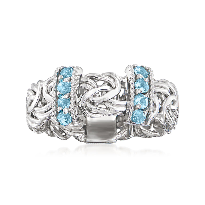Sterling silver Byzantine ring with blue topaz in side-set prong rows