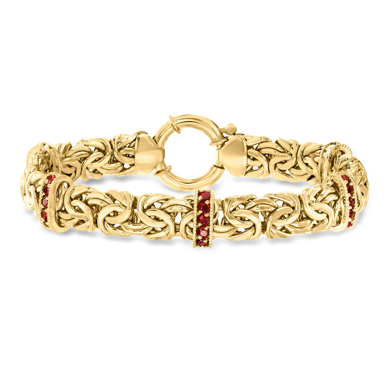 Gold-tone Byzantine chain bracelet with red garnet-style gemstones and hinged clasp