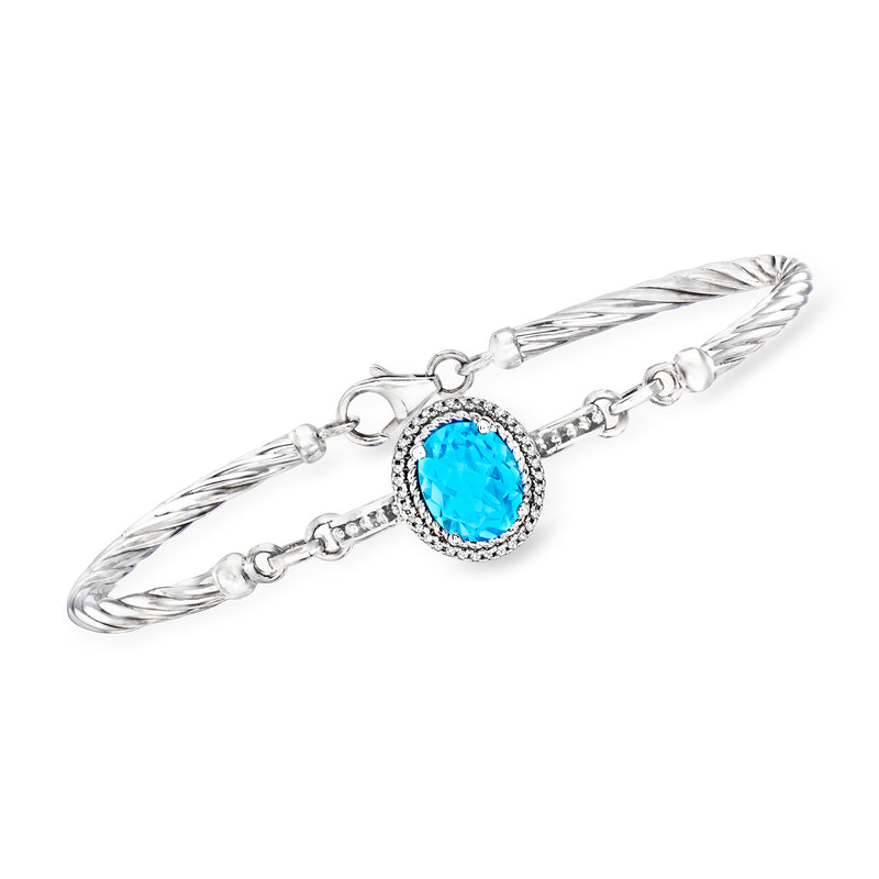 Sterling silver bracelet with oval blue topaz and diamond halo bezel links