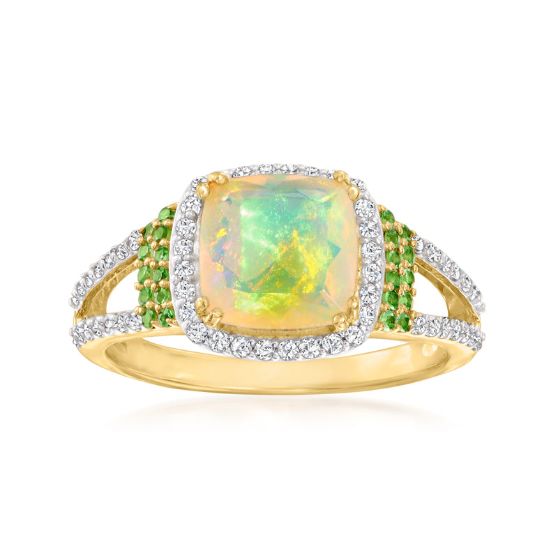 Gold opal ring with rectangular opal center, green side stones, and white zircon halo