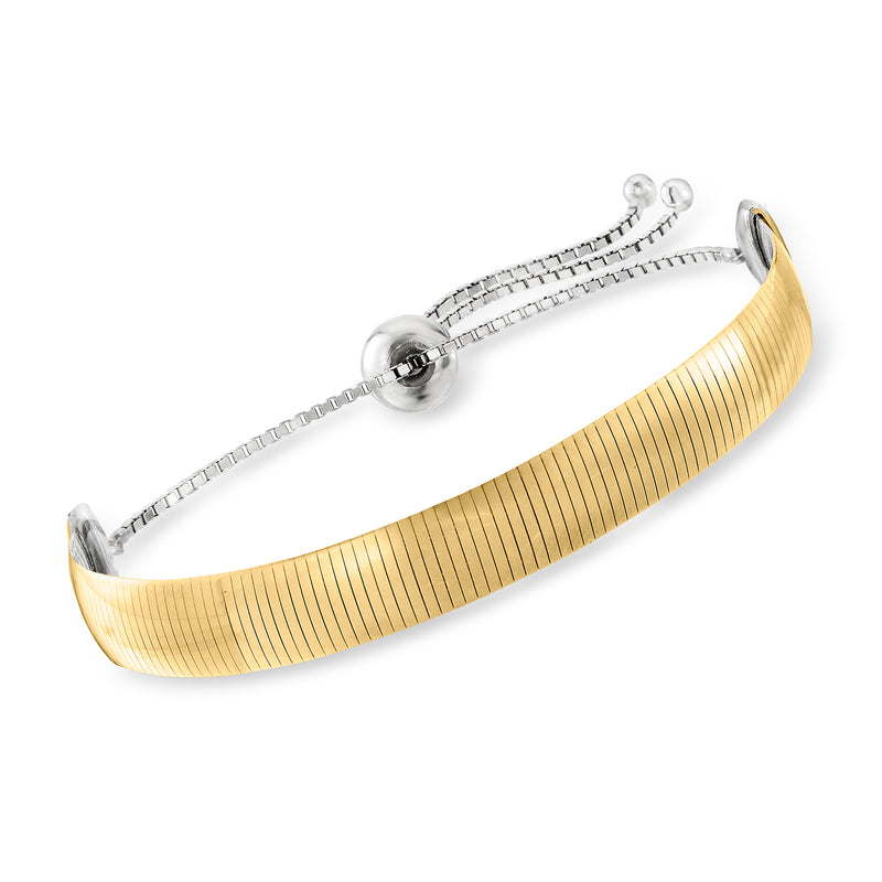 Reversible bolo bracelet with ribbed gold over sterling silver and round clasp ends
