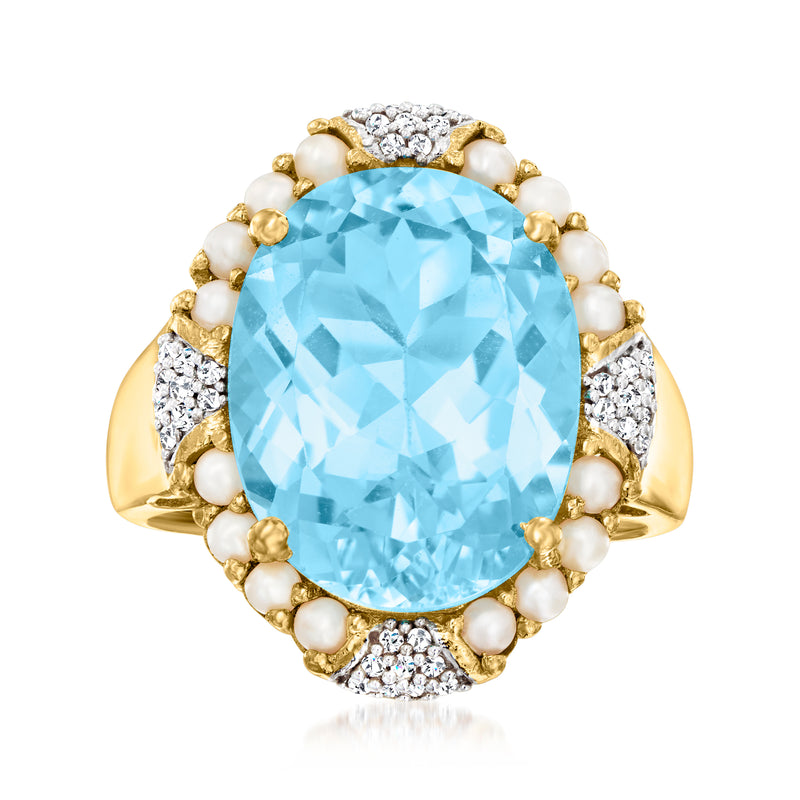 Oval sky blue topaz ring with diamond accents and seed pearls in gold setting