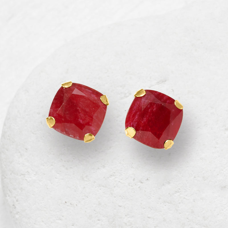 Red ruby cushion-cut stud earrings in 14kt yellow gold, four-prong setting