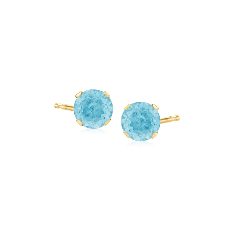 Round blue Swiss topaz martini stud earrings in 14kt yellow gold.