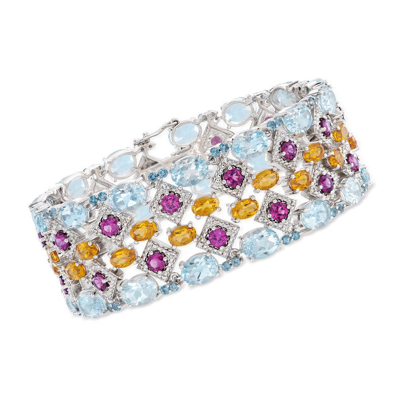 Sterling silver multi-gemstone bracelet with oval blue, purple, and orange stones