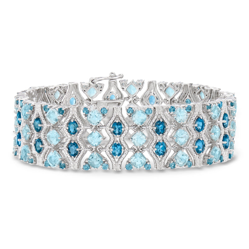 Sterling silver blue topaz bracelet with ornate lattice setting and oval stones