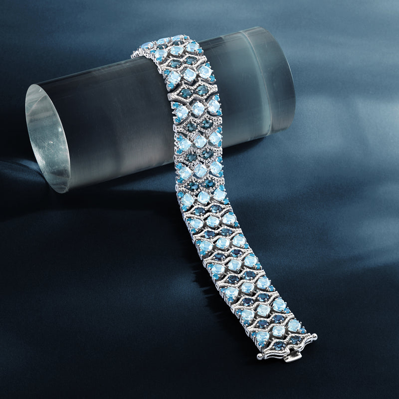 Sterling silver blue topaz tennis bracelet with linked hexagonal settings