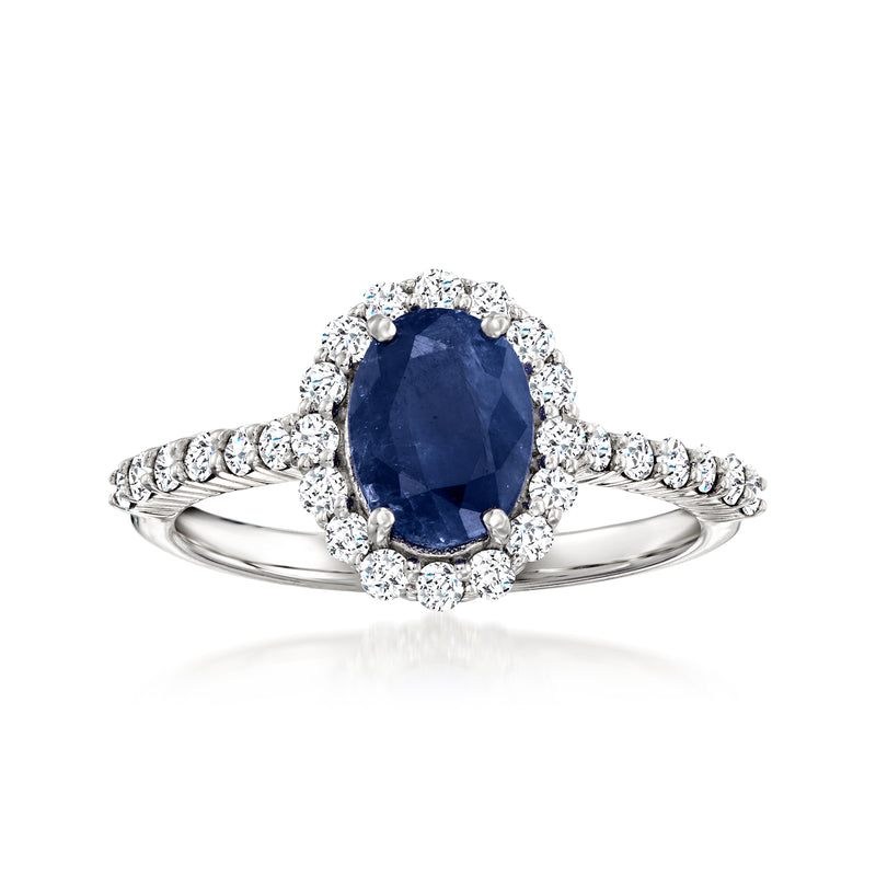 14k white gold ring with oval blue sapphire center and diamond halo, prong-set