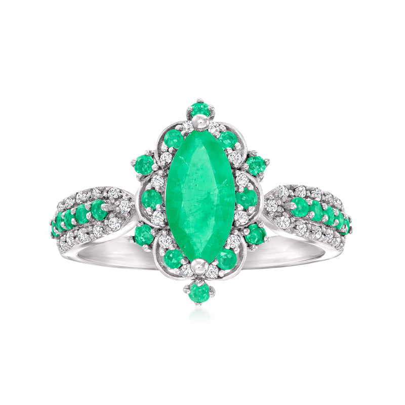14kt white gold ring with pear-shaped emerald center, green stones, and diamond accents