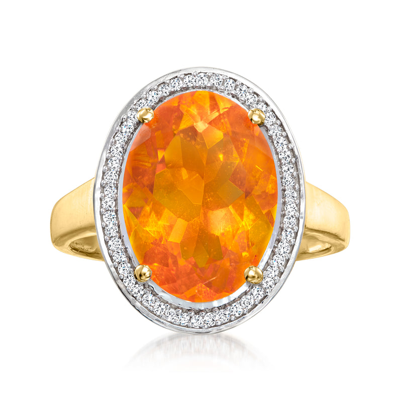 Oval orange fire opal ring with diamond halo and 14kt yellow gold band