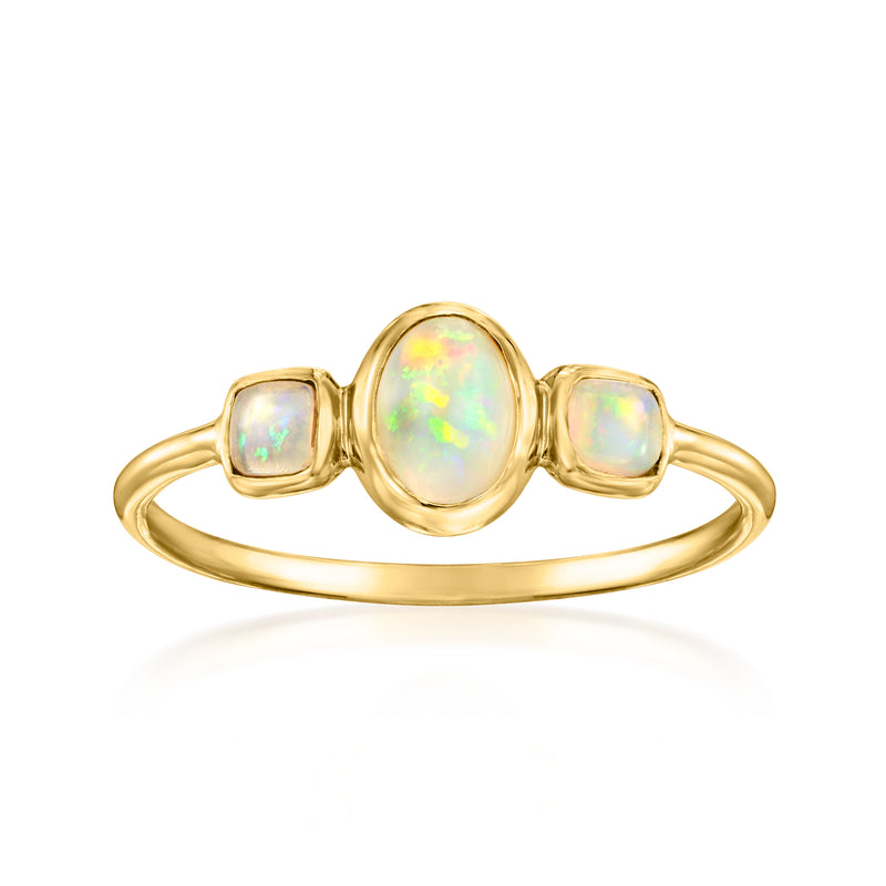 14kt yellow gold three-stone ring with oval center opal and two square opal accents